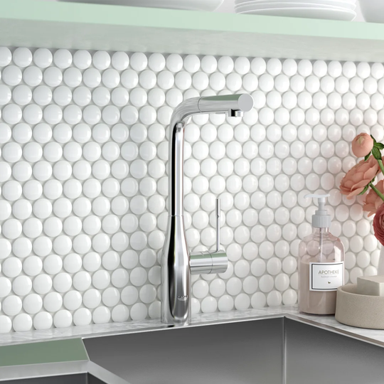 GROHE Essence single-lever kitchen tap with high L-shaped spout. A German engineered sink mixer with 360° swivel range and pull-out comfort shower hea