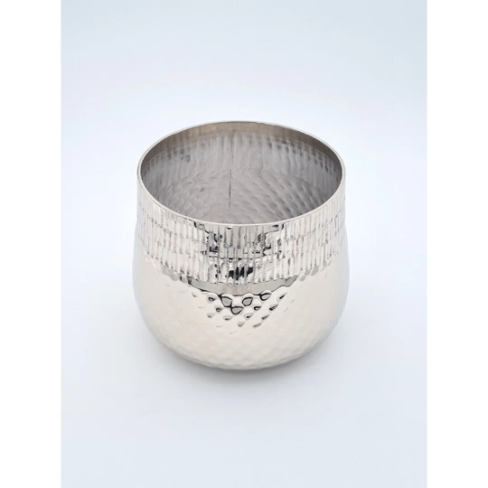 This plant pot is made of silver metal. It is made of solid aluminum and has a modern, decorative design