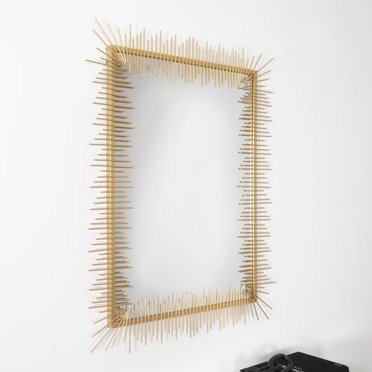 Briseis Metal Framed Wall Mounted Accent Mirror in Gold