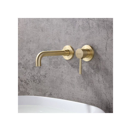 Contemporary wall-mounted single-handle bathroom sink faucet in brushed brass